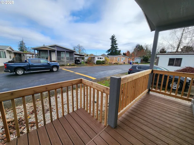 a view of a car park in front of the house