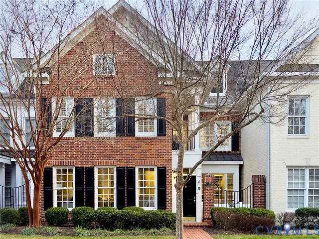 a living room with furniture and windows