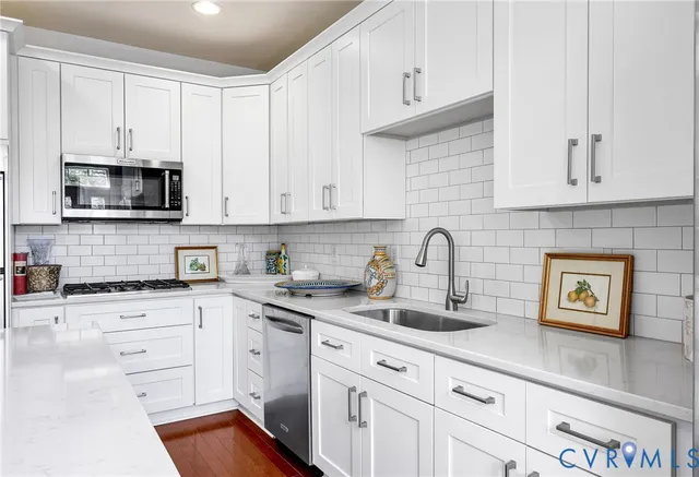 a spacious bathroom with a granite countertop tub sink and mirror