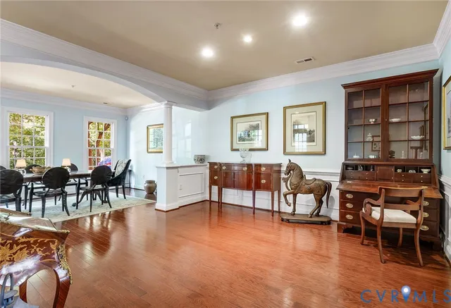 a view of a dining room with furniture and wooden floor