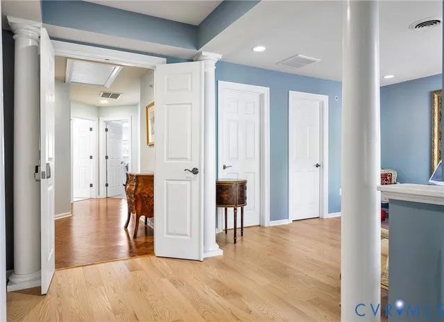 a living room with furniture and large windows