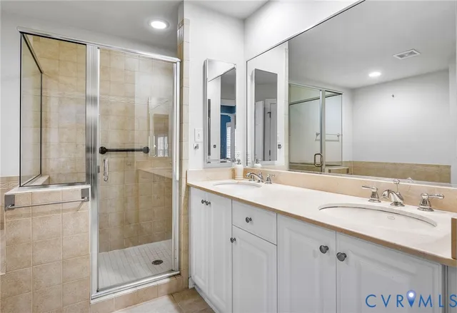 a bathroom with a bathtub and shower