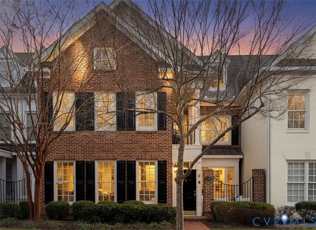 a living room with furniture a mirror and a fireplace