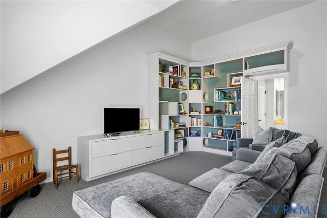 a bathroom with double vanity sinks and a shower
