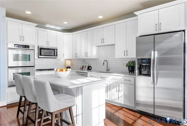 a living room with furniture and windows