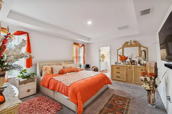a bed room with a bed and a furniture