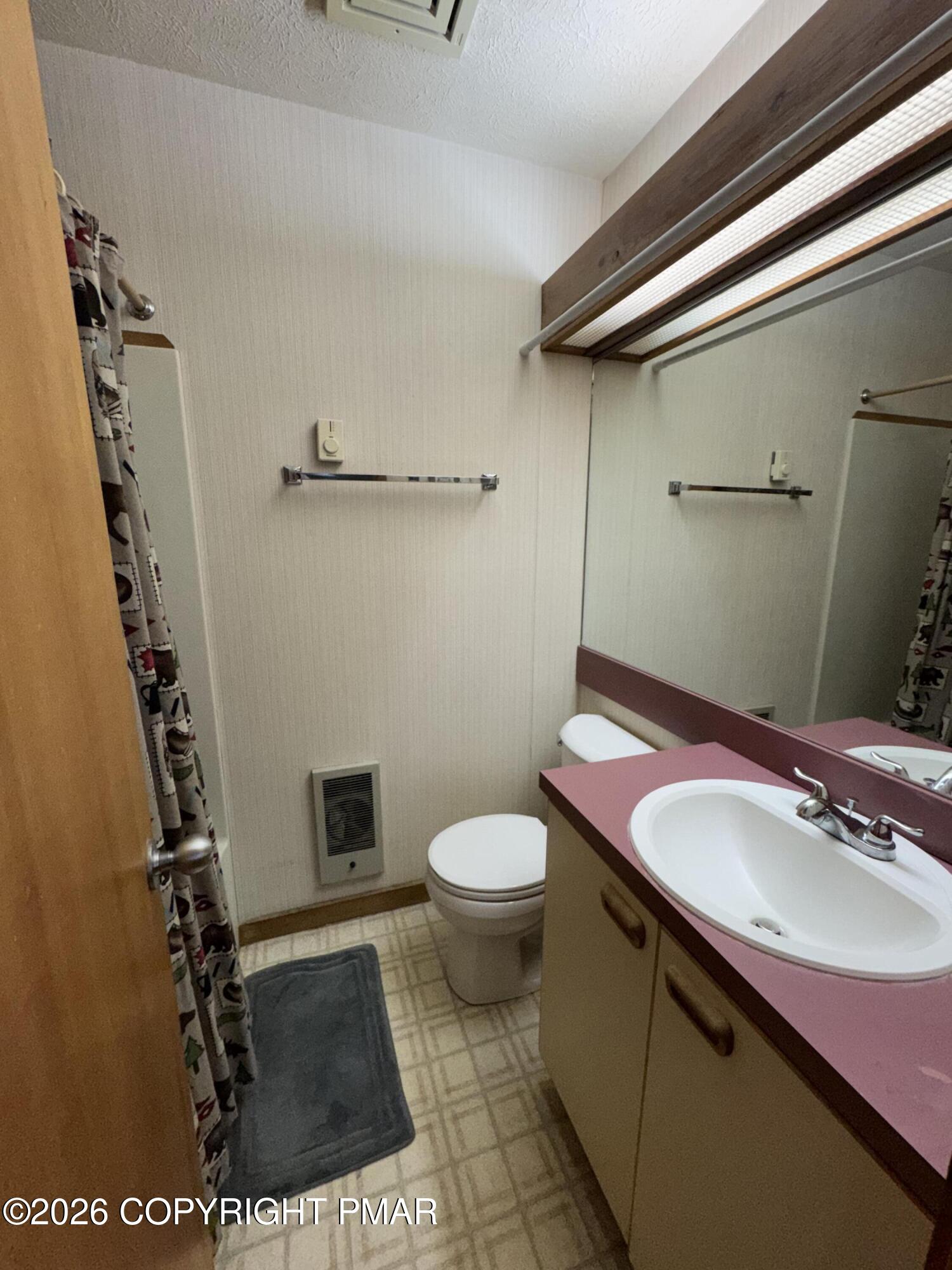 273 Northslope II Road East Stroudsburg, PA 18302 - Photo 11 of 15 a bathroom with a sink a toilet and a mirror