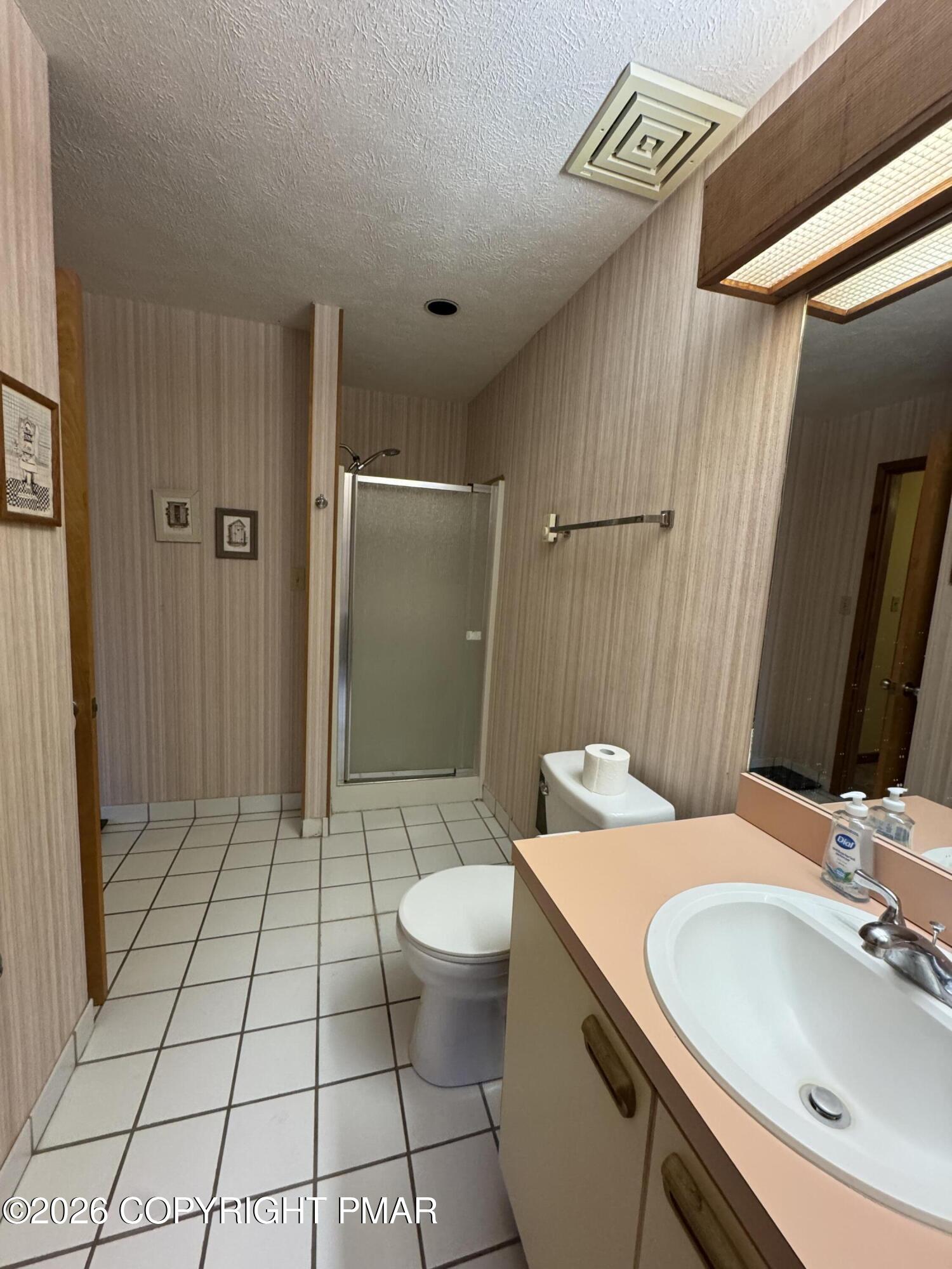 273 Northslope II Road East Stroudsburg, PA 18302 - Photo 14 of 15 a bathroom with a sink a toilet a mirror and shower