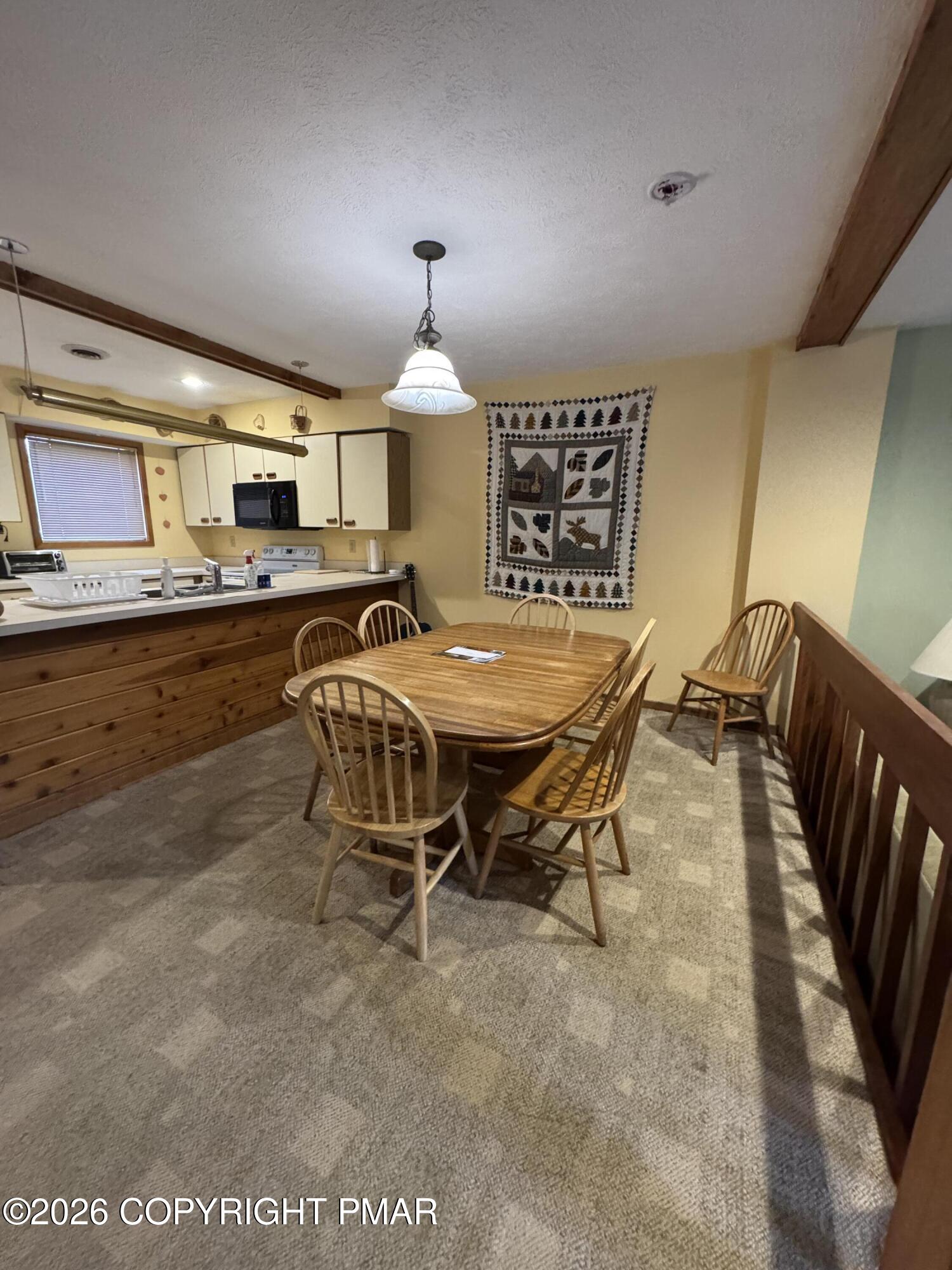 273 Northslope II Road East Stroudsburg, PA 18302 - Photo 4 of 15 a view of a kitchen with dining table and chairs