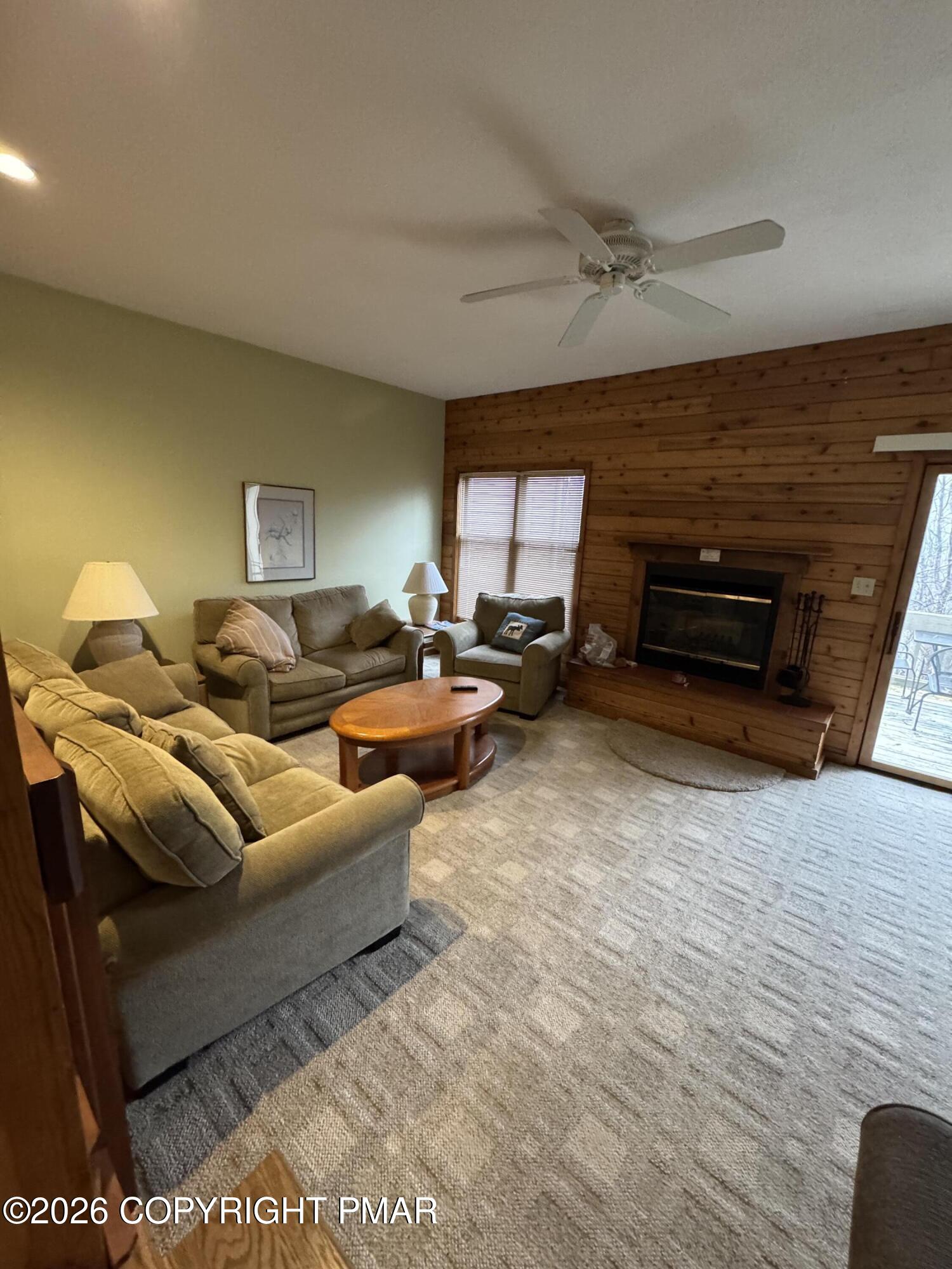 273 Northslope II Road East Stroudsburg, PA 18302 - Photo 5 of 15 a living room with furniture and a fireplace