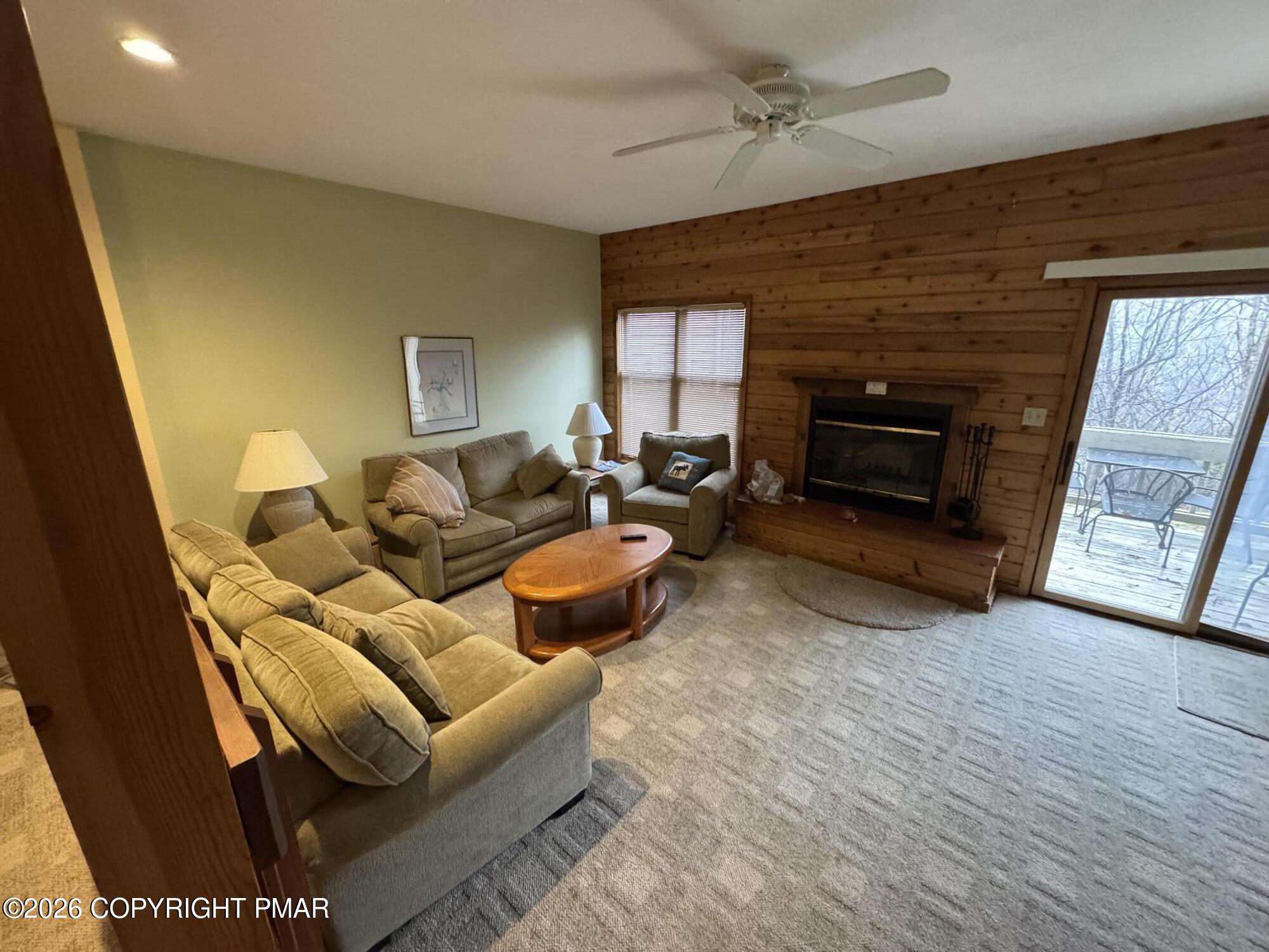 273 Northslope II Road East Stroudsburg, PA 18302 - Photo 6 of 15 a living room with furniture a fireplace and a flat screen tv