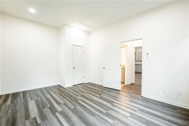 an empty room with wooden floor