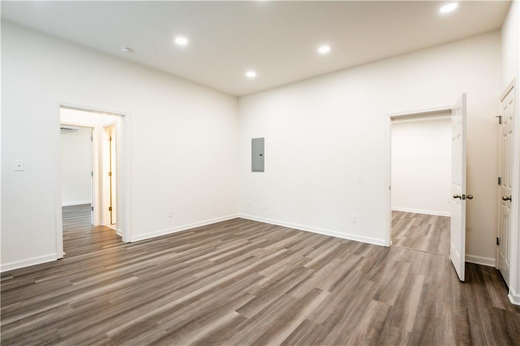 1359 Finley Street Northeast, Unit C Atlanta, GA 30307 - Photo 2 of 19 an empty room with wooden floor and windows