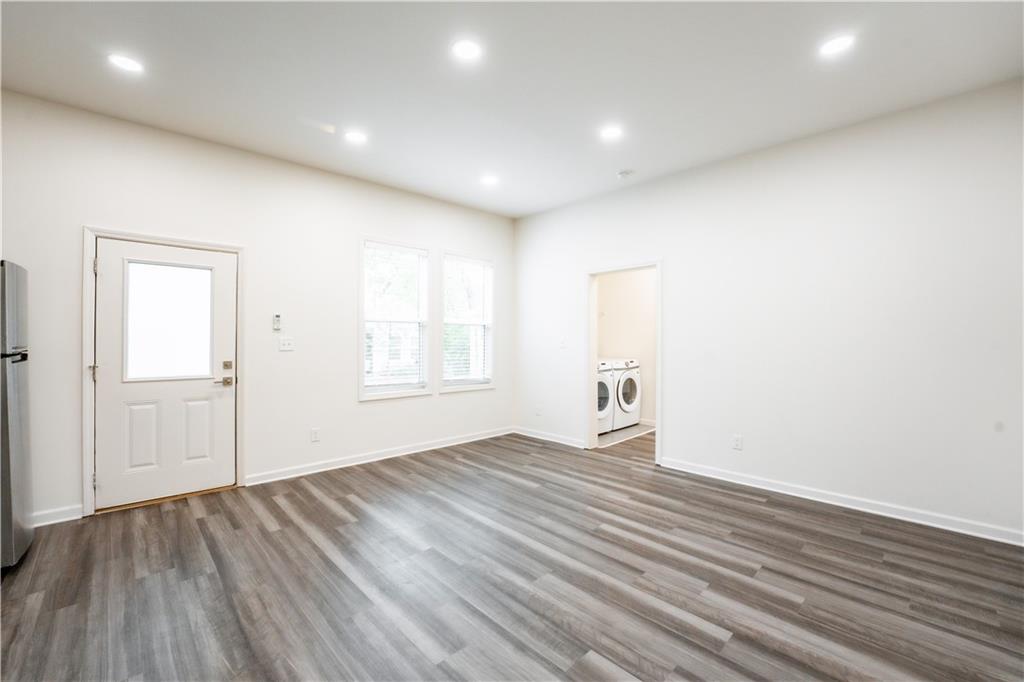 1359 Finley Street Northeast, Unit C Atlanta, GA 30307 - Photo 6 of 19 wooden floor in an empty room with a window