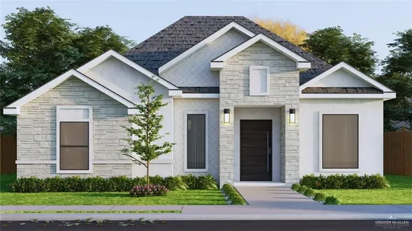 a front view of a house with a yard and trees