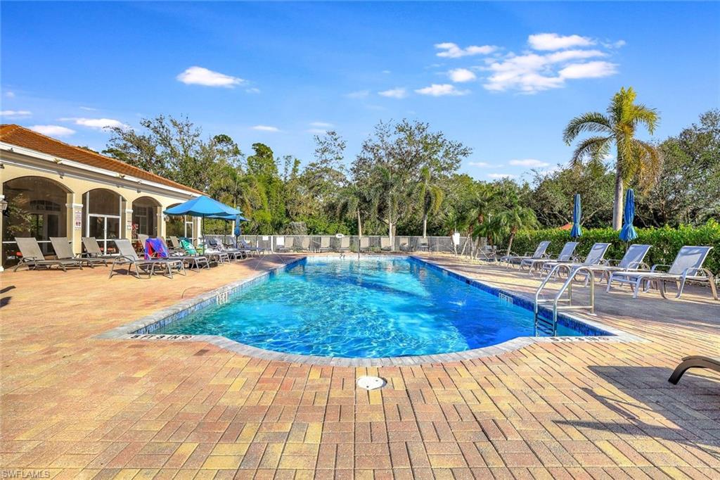 4530 Botanical Pl Circle, Unit 103 Naples, FL 34112 - Photo 29 of 32 View of swimming pool featuring a patio area