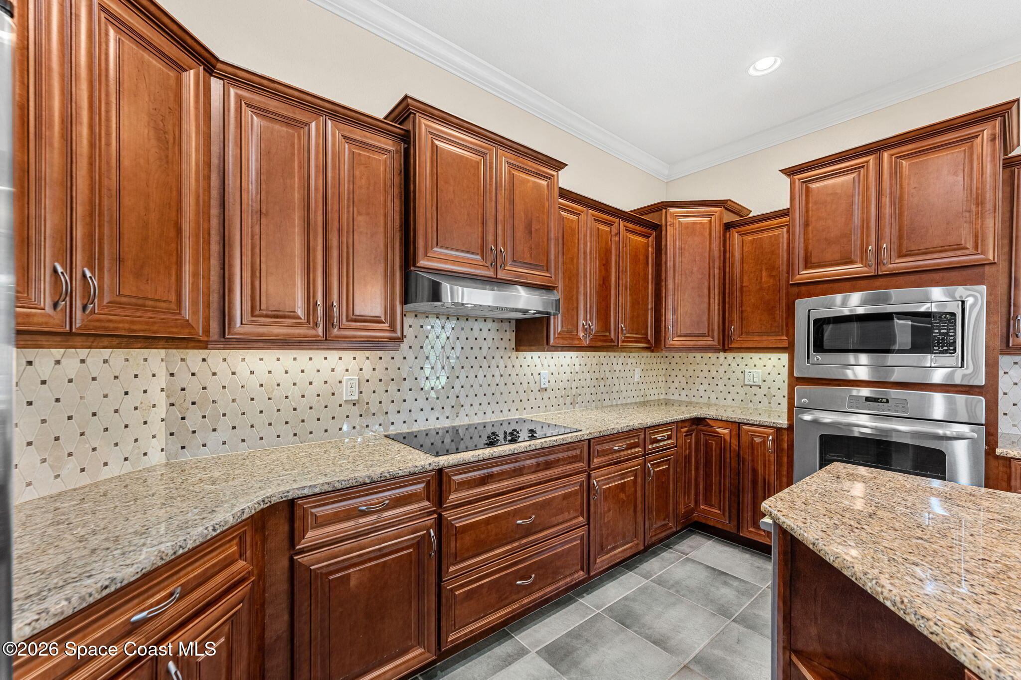 4148 Anlow Road Melbourne, FL 32904 - Photo 15 of 67 a kitchen with stainless steel appliances granite countertop a sink dishwasher stove and cabinets with wooden floor