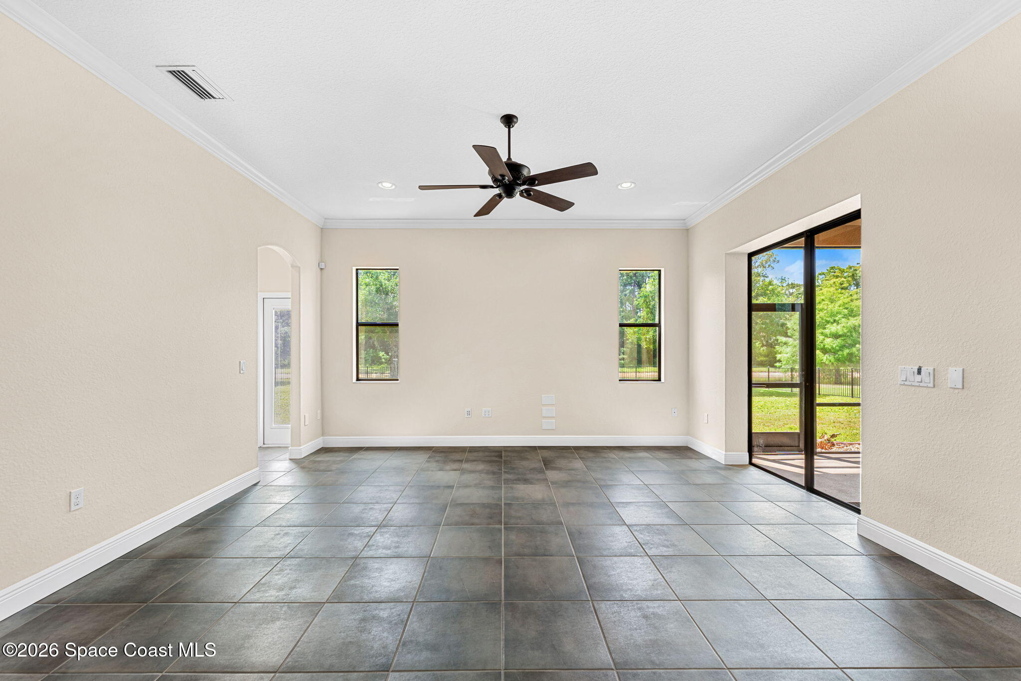 4148 Anlow Road Melbourne, FL 32904 - Photo 19 of 67 a view of an empty room with a window