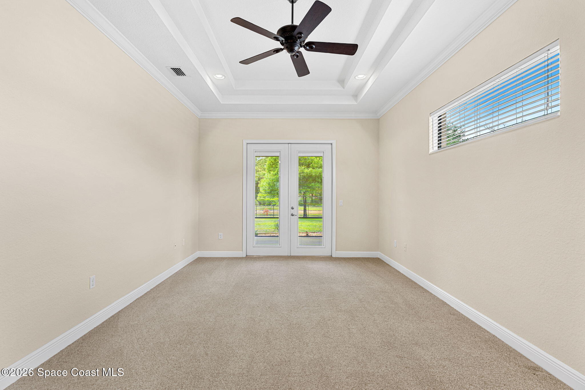 4148 Anlow Road Melbourne, FL 32904 - Photo 21 of 67 an empty room with a window and a fan