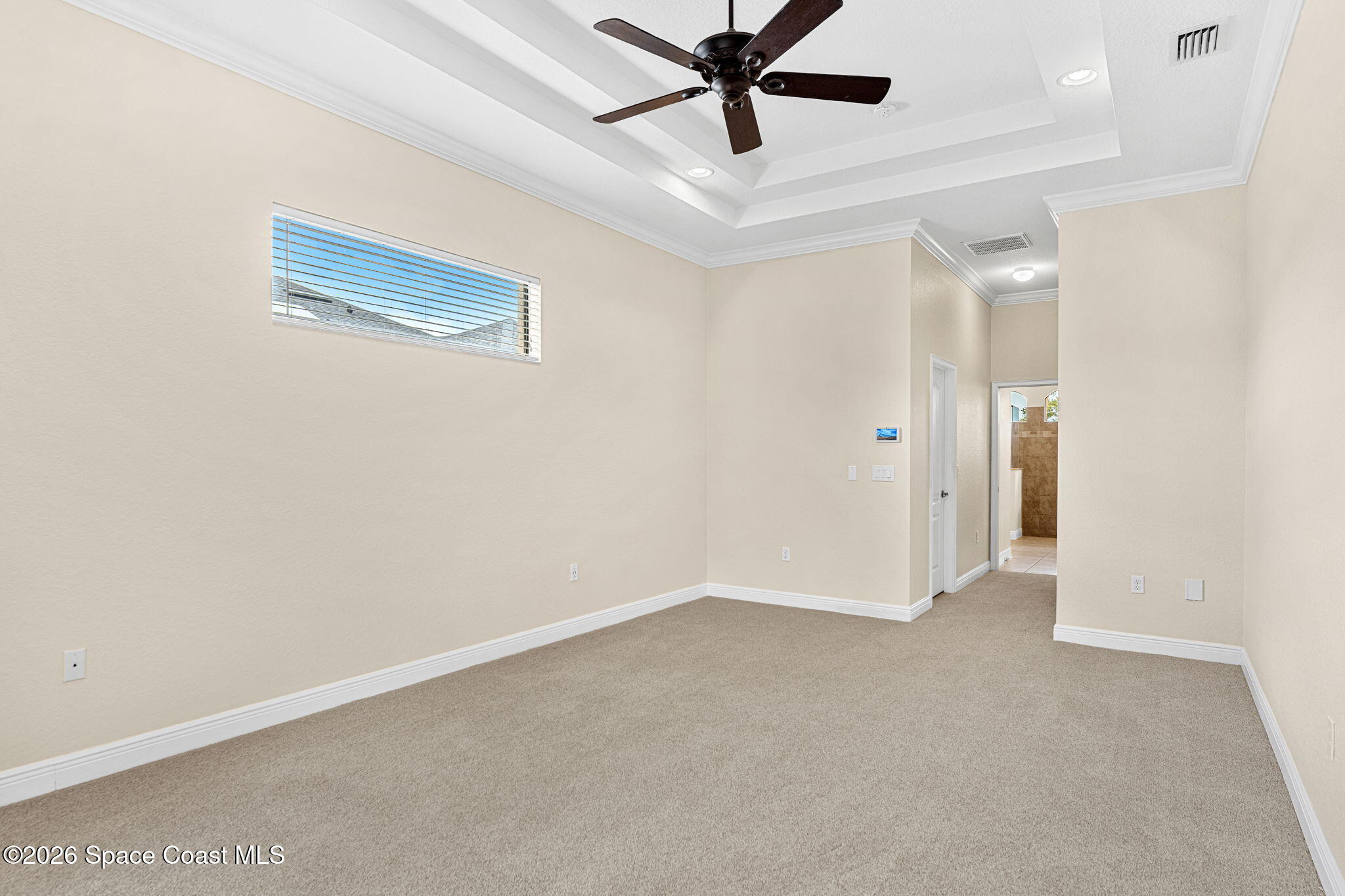 4148 Anlow Road Melbourne, FL 32904 - Photo 22 of 67 a view of a room with a ceiling fan