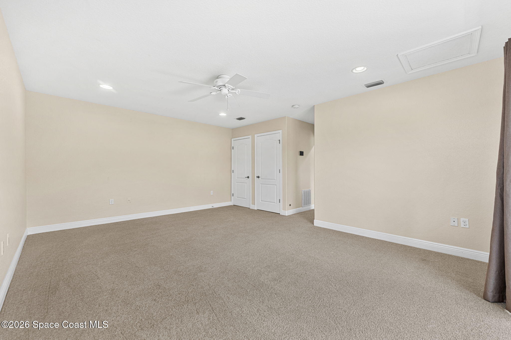 4148 Anlow Road Melbourne, FL 32904 - Photo 41 of 67 an empty room with a ceiling fan and window