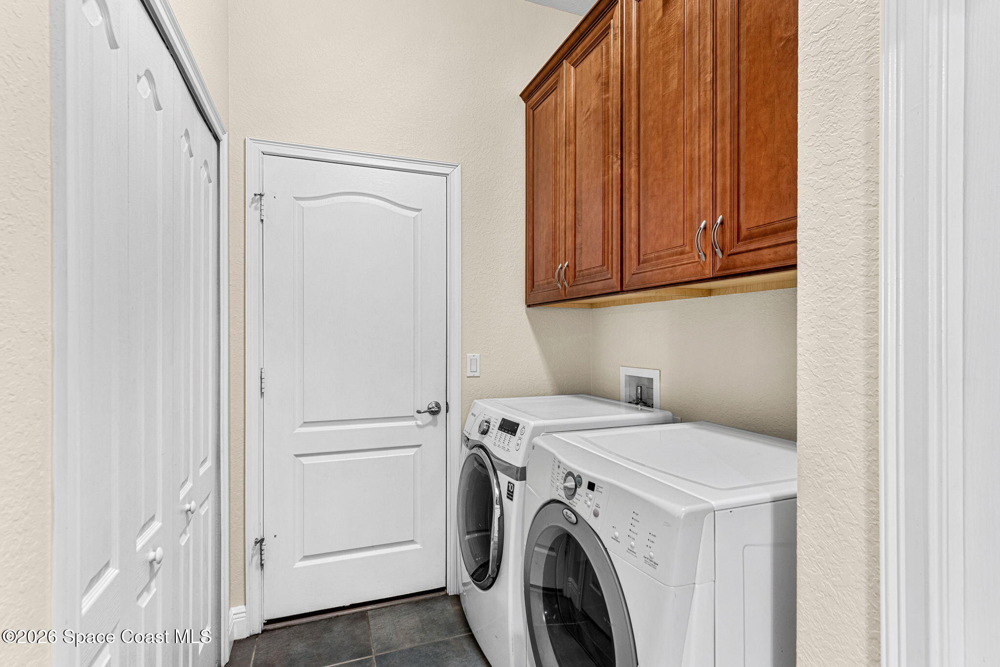 4148 Anlow Road Melbourne, FL 32904 - Photo 44 of 67 a utility room with dryer and washer