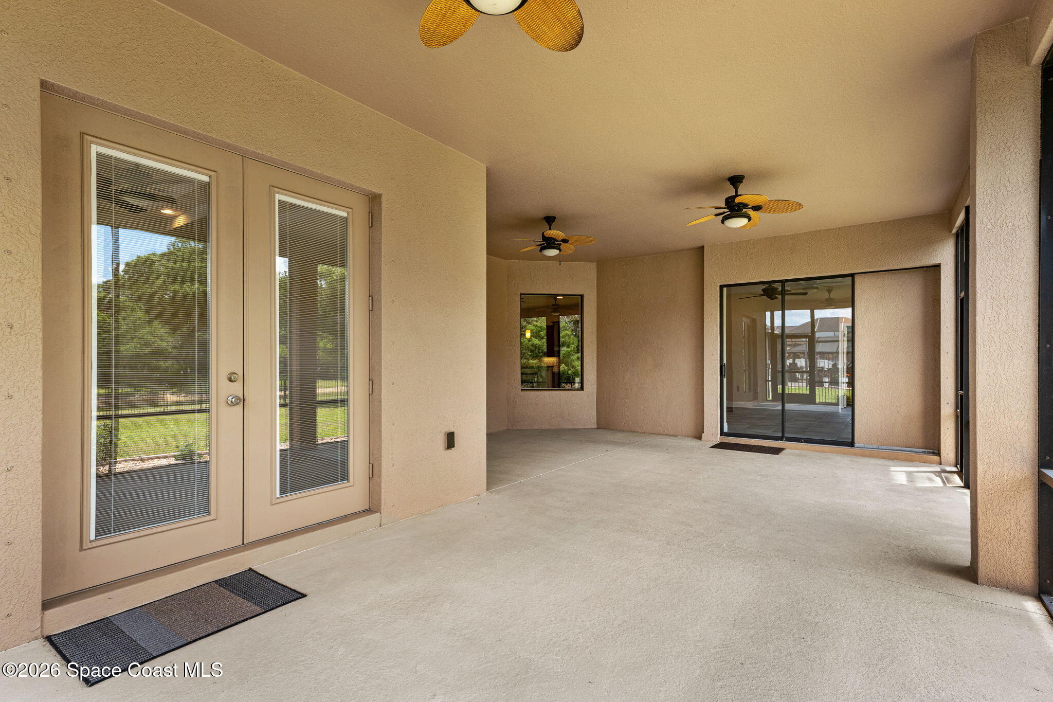 4148 Anlow Road Melbourne, FL 32904 - Photo 47 of 67 a view of an empty room with glass door