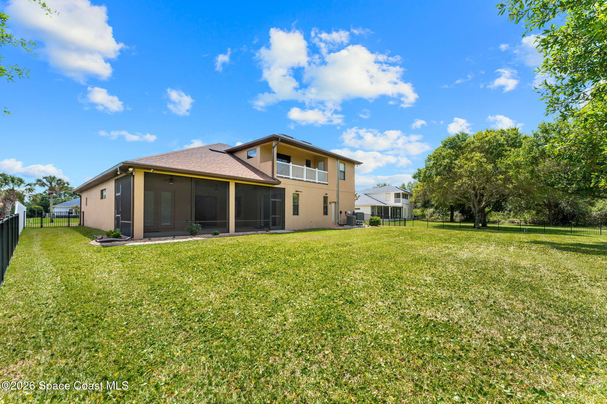 4148 Anlow Road Melbourne, FL 32904 - Photo 49 of 67 a view of a house with a big yard and large trees