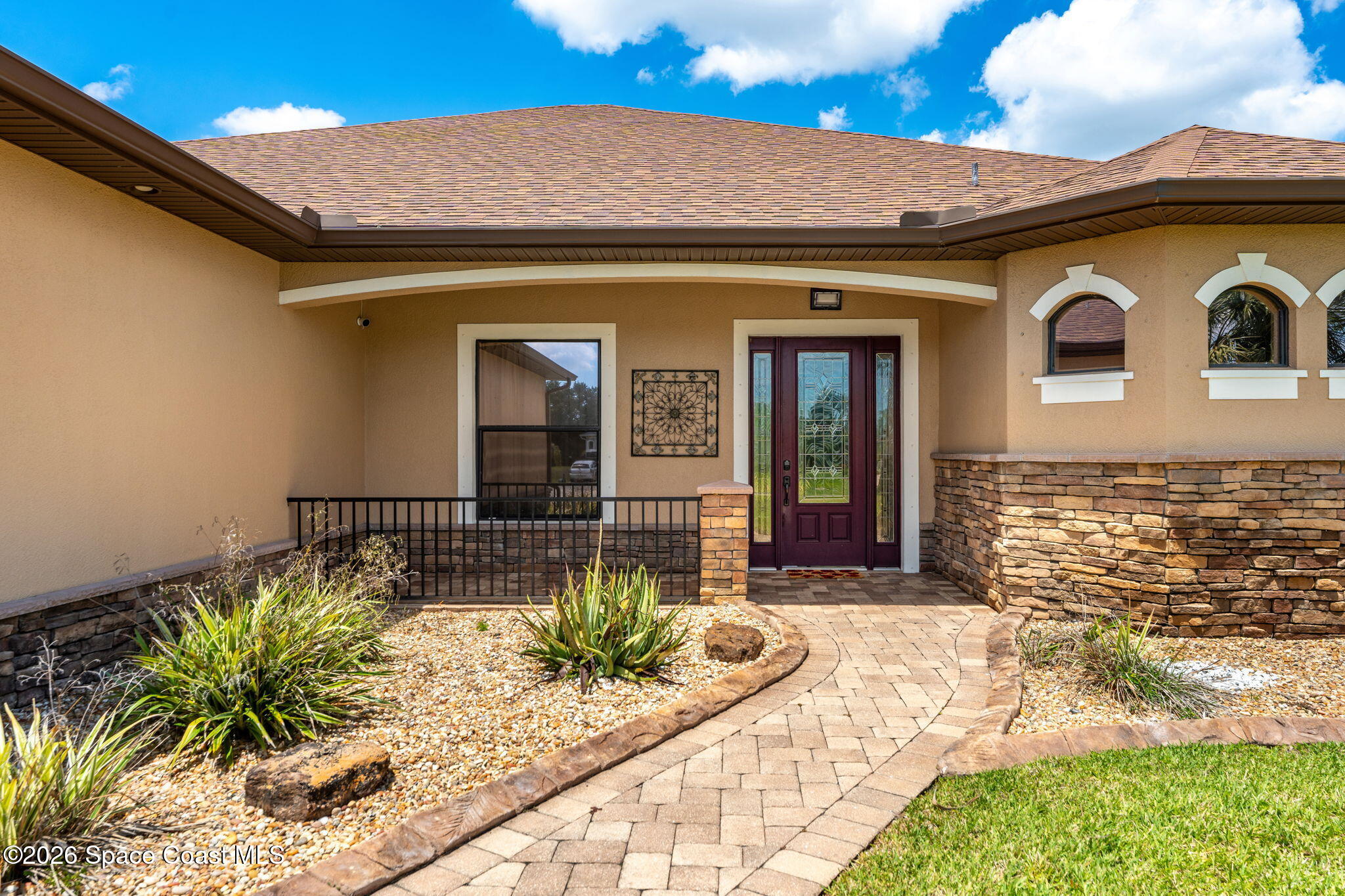 4148 Anlow Road Melbourne, FL 32904 - Photo 5 of 67 a front view of a house with balcony