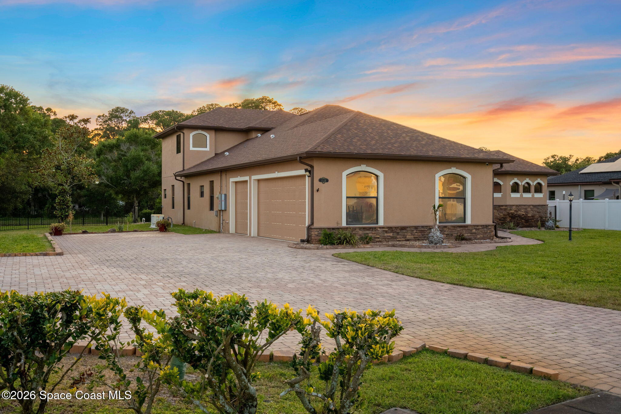 4148 Anlow Road Melbourne, FL 32904 - Photo 55 of 67 a view of a yard with a house and a garden