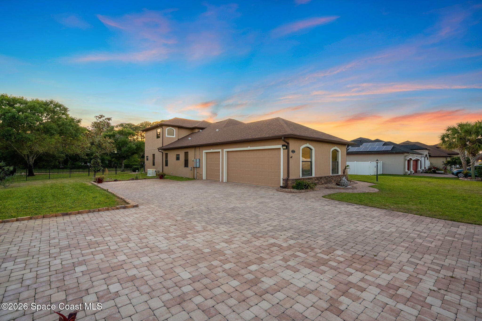 4148 Anlow Road Melbourne, FL 32904 - Photo 58 of 67 a front view of a house with a yard and garage