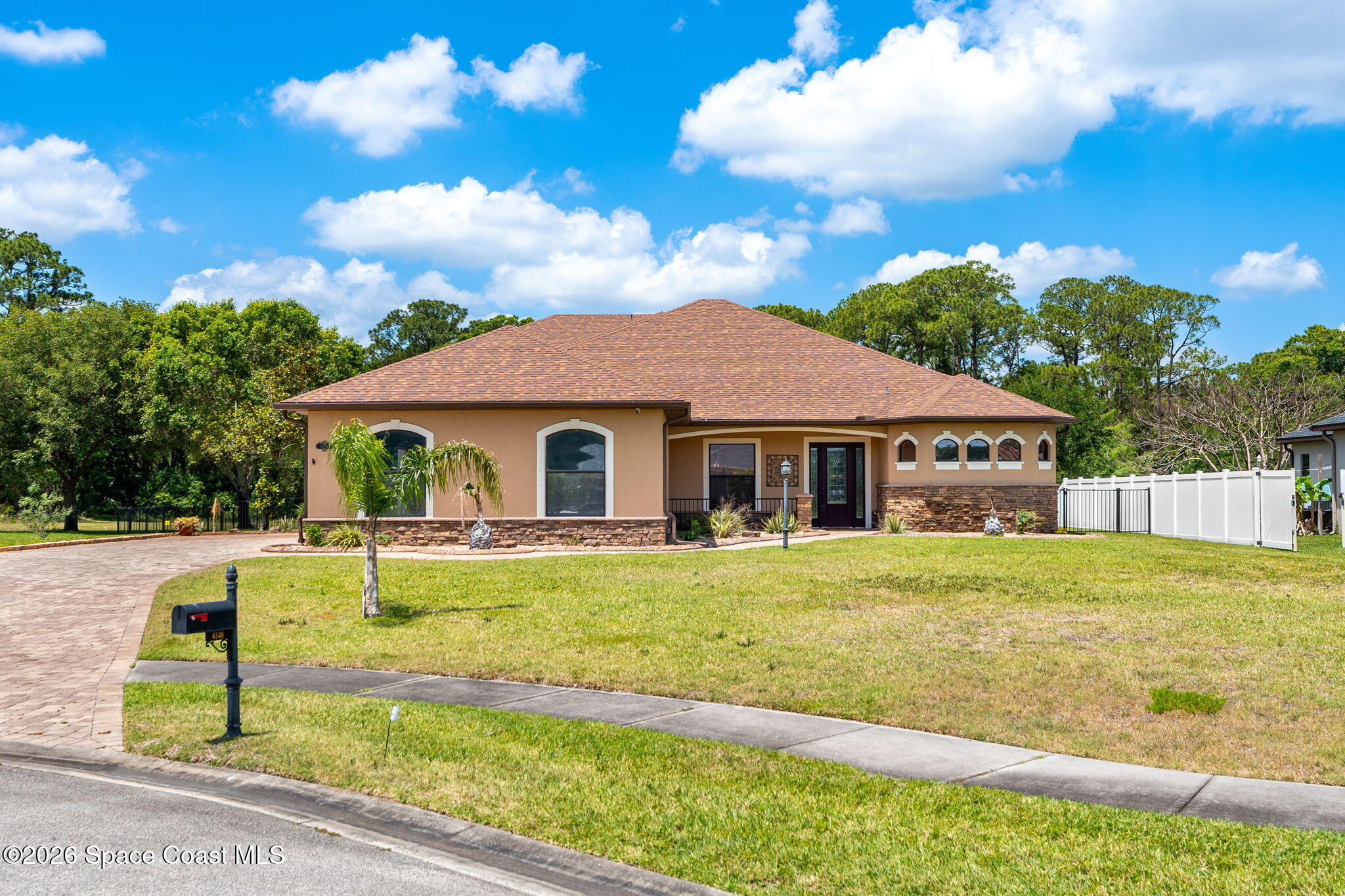 4148 Anlow Road Melbourne, FL 32904 - Photo 60 of 67 a front view of a house with garden