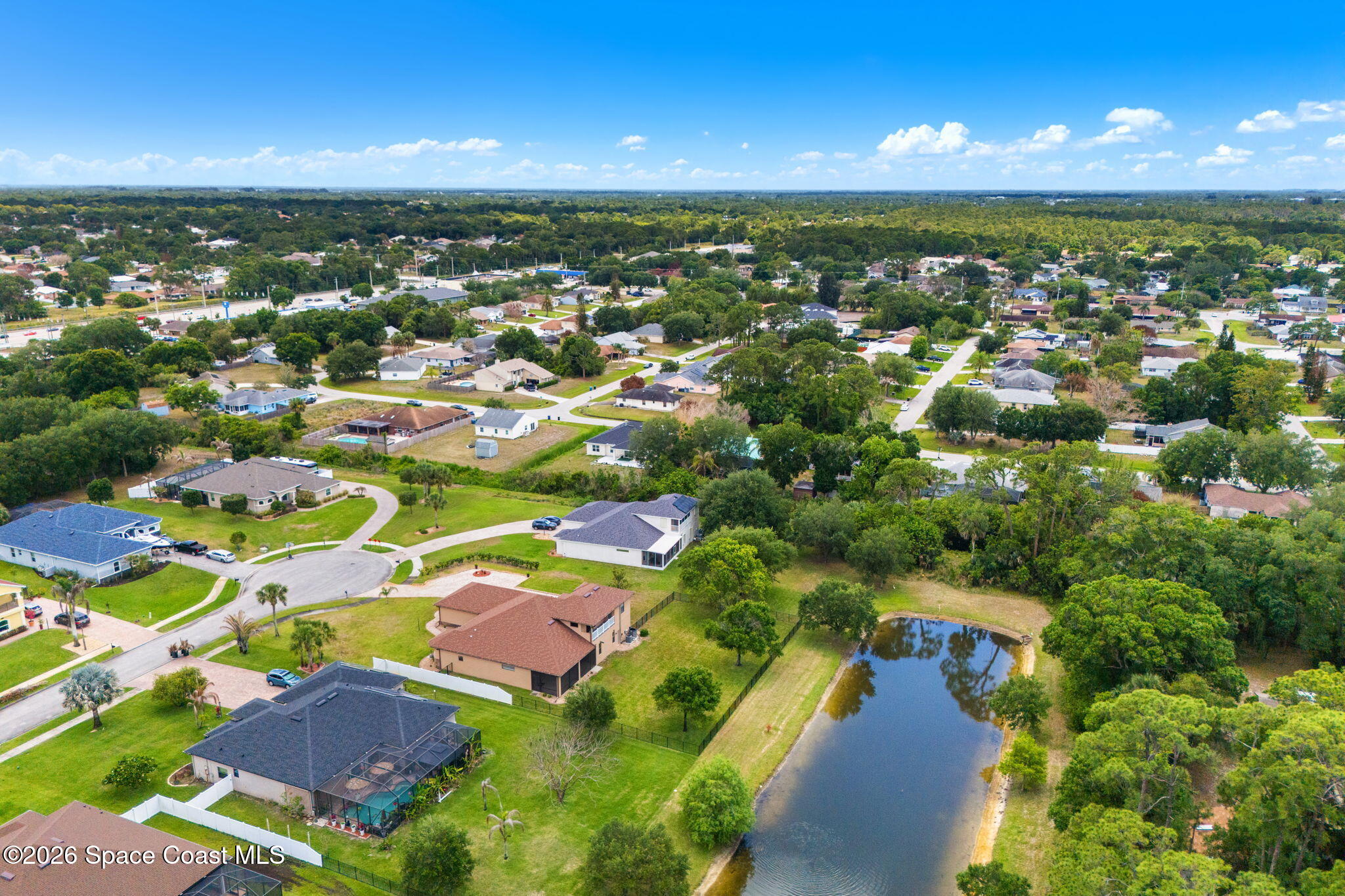 4148 Anlow Road Melbourne, FL 32904 - Photo 64 of 67 an aerial view of residential houses with outdoor space and trees