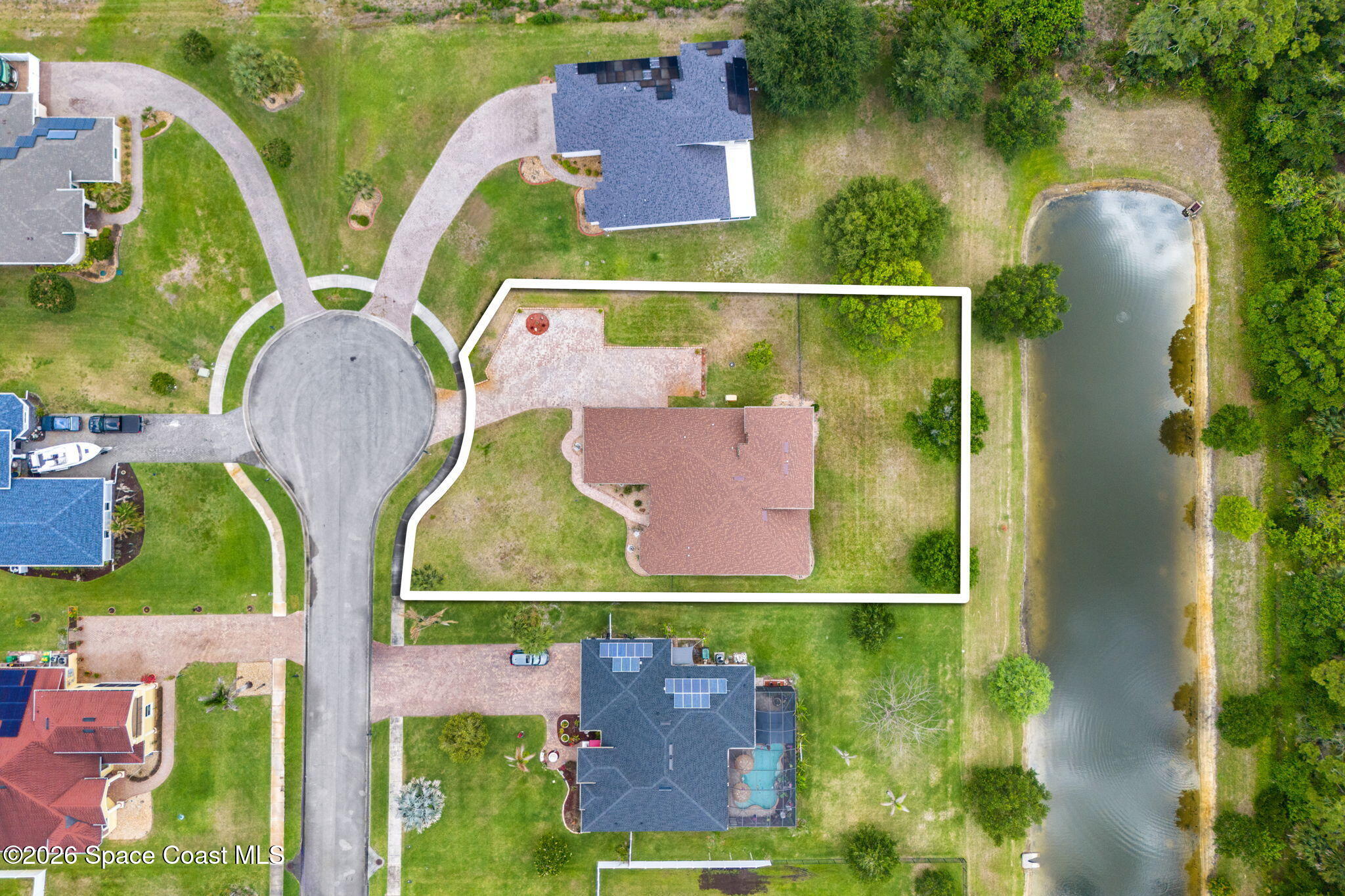4148 Anlow Road Melbourne, FL 32904 - Photo 67 of 67 an aerial view of a swimming pool with outdoor seating and yard