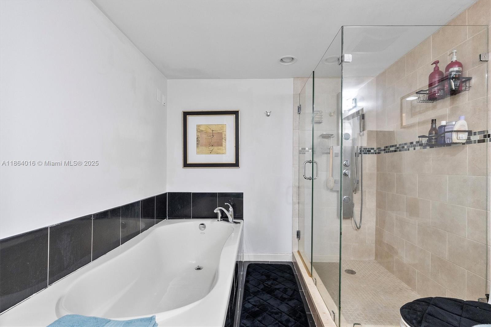 4000 Northeast 168th Street, Unit PH5A North Miami Beach, FL 33160 - Photo 14 of 33 a bathroom with a bathtub and shower