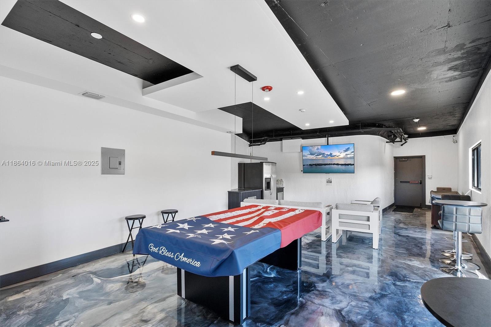 4000 Northeast 168th Street, Unit PH5A North Miami Beach, FL 33160 - Photo 22 of 33 a dining room with a table and chairs