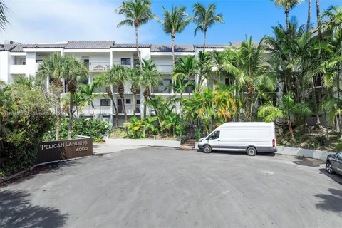 a view of a lake with tall buildings
