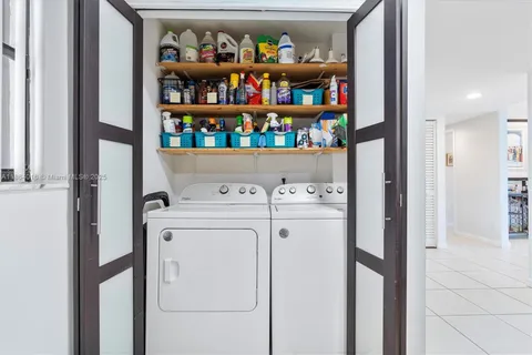 a view of washer and dryer in a utility room