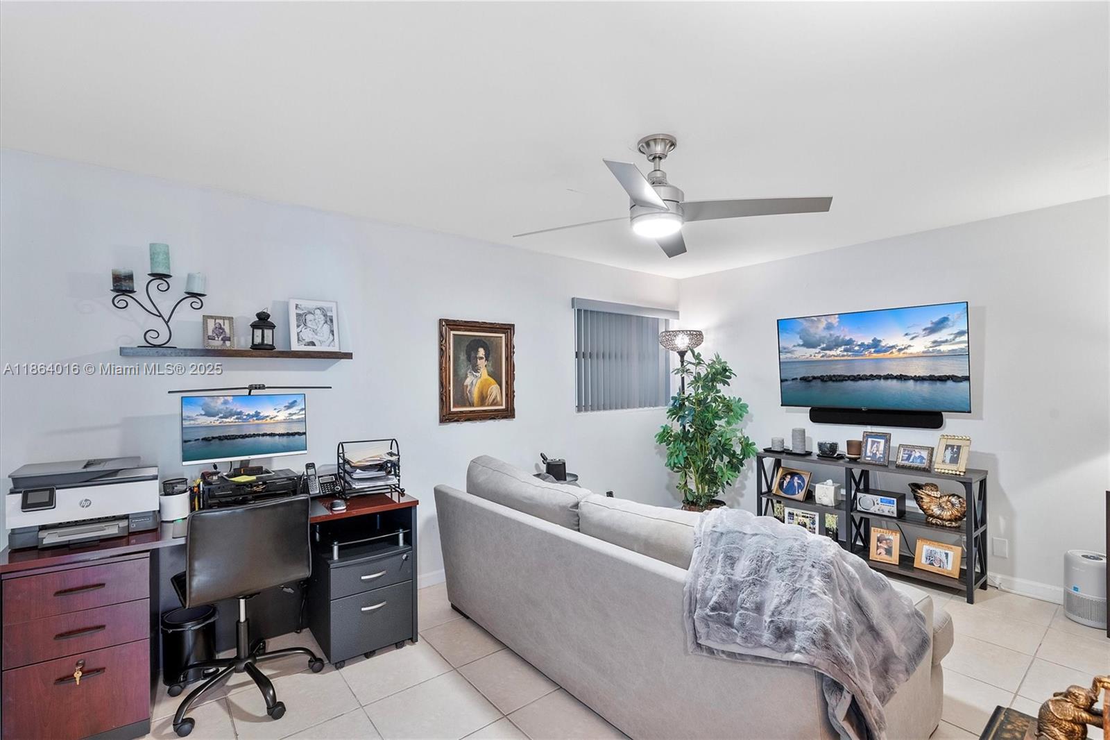 4000 Northeast 168th Street, Unit PH5A North Miami Beach, FL 33160 - Photo 10 of 33 a living room with furniture and a flat screen tv