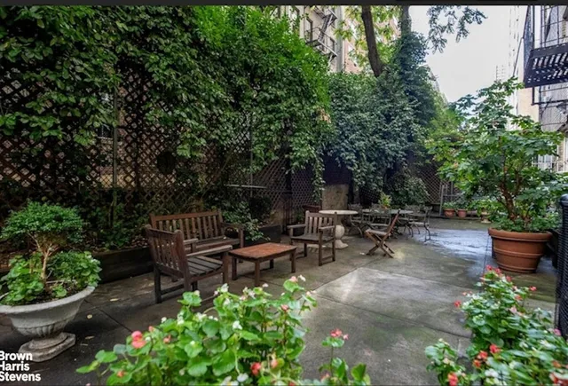 a view of a kitchen with a sink and cabinets