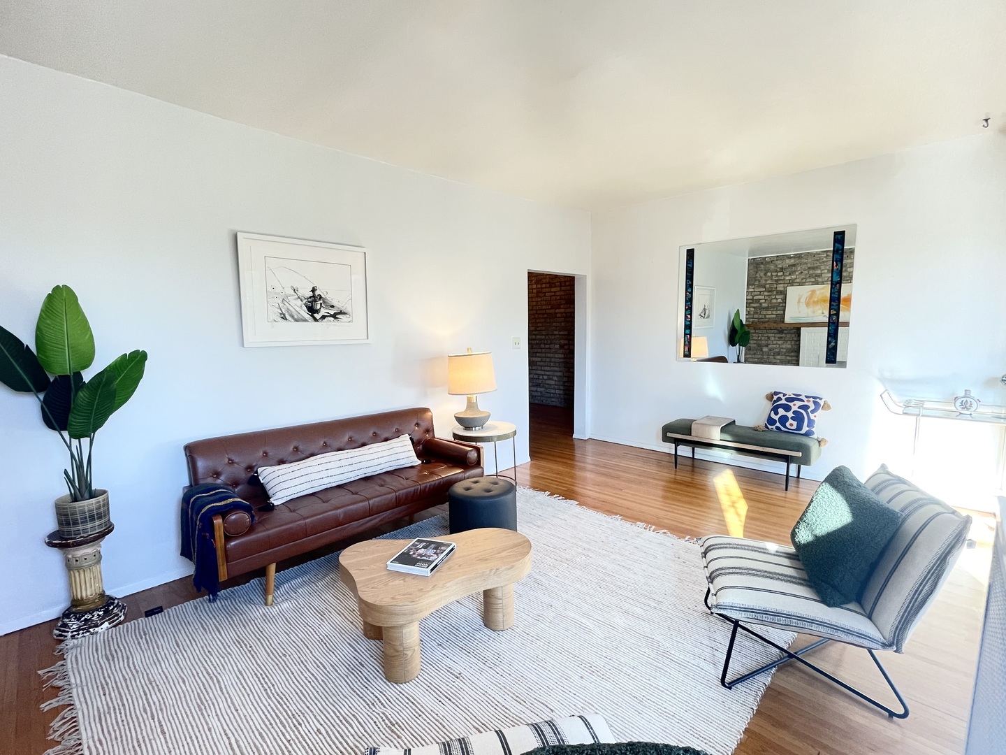 2810 West Logan Boulevard, Unit 3W Chicago, IL 60647 - Photo 11 of 34 a living room with furniture and a wooden floor