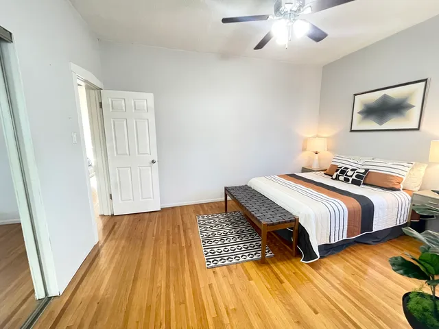 a view of hallway with wooden floor
