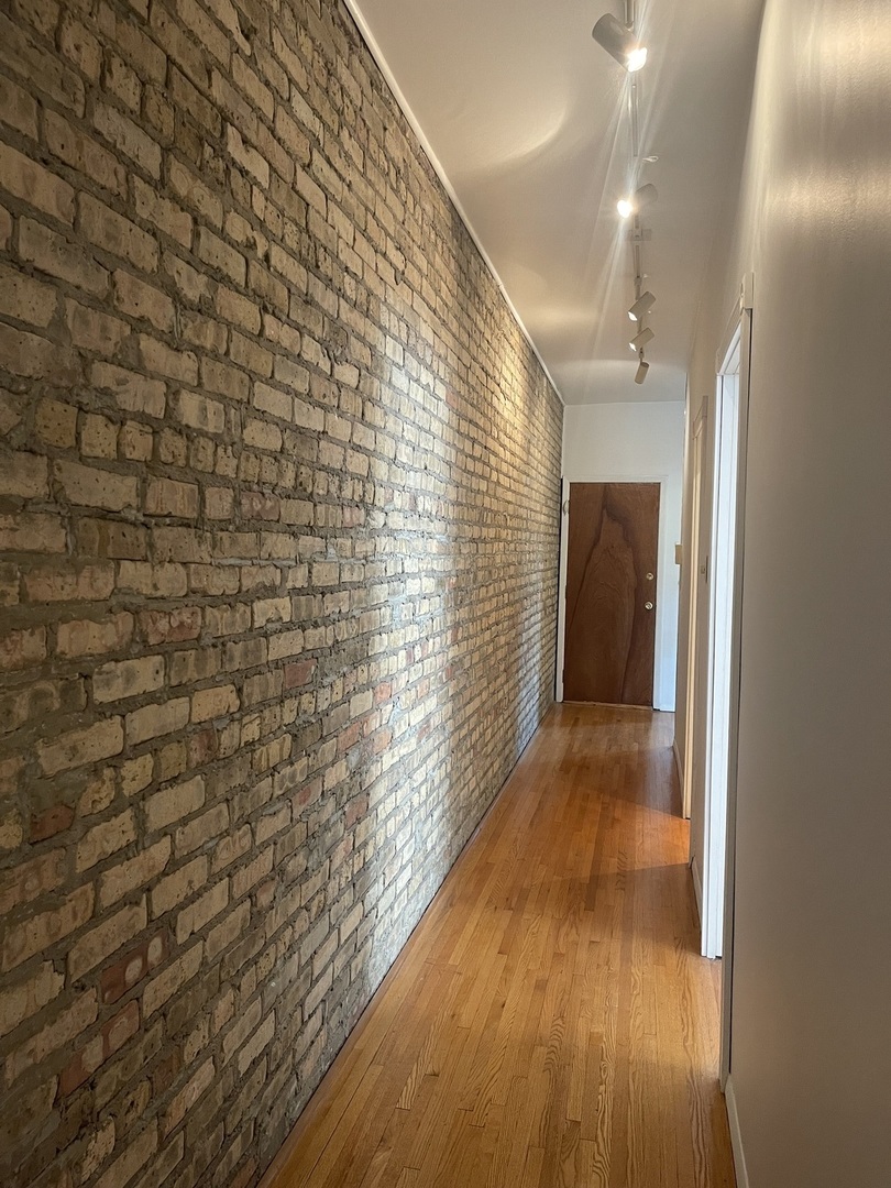 2810 West Logan Boulevard, Unit 3W Chicago, IL 60647 - Photo 17 of 34 a view of hallway with wooden floor