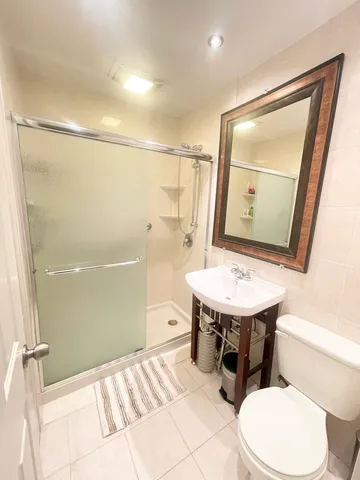 a bathroom with a tub and shower
