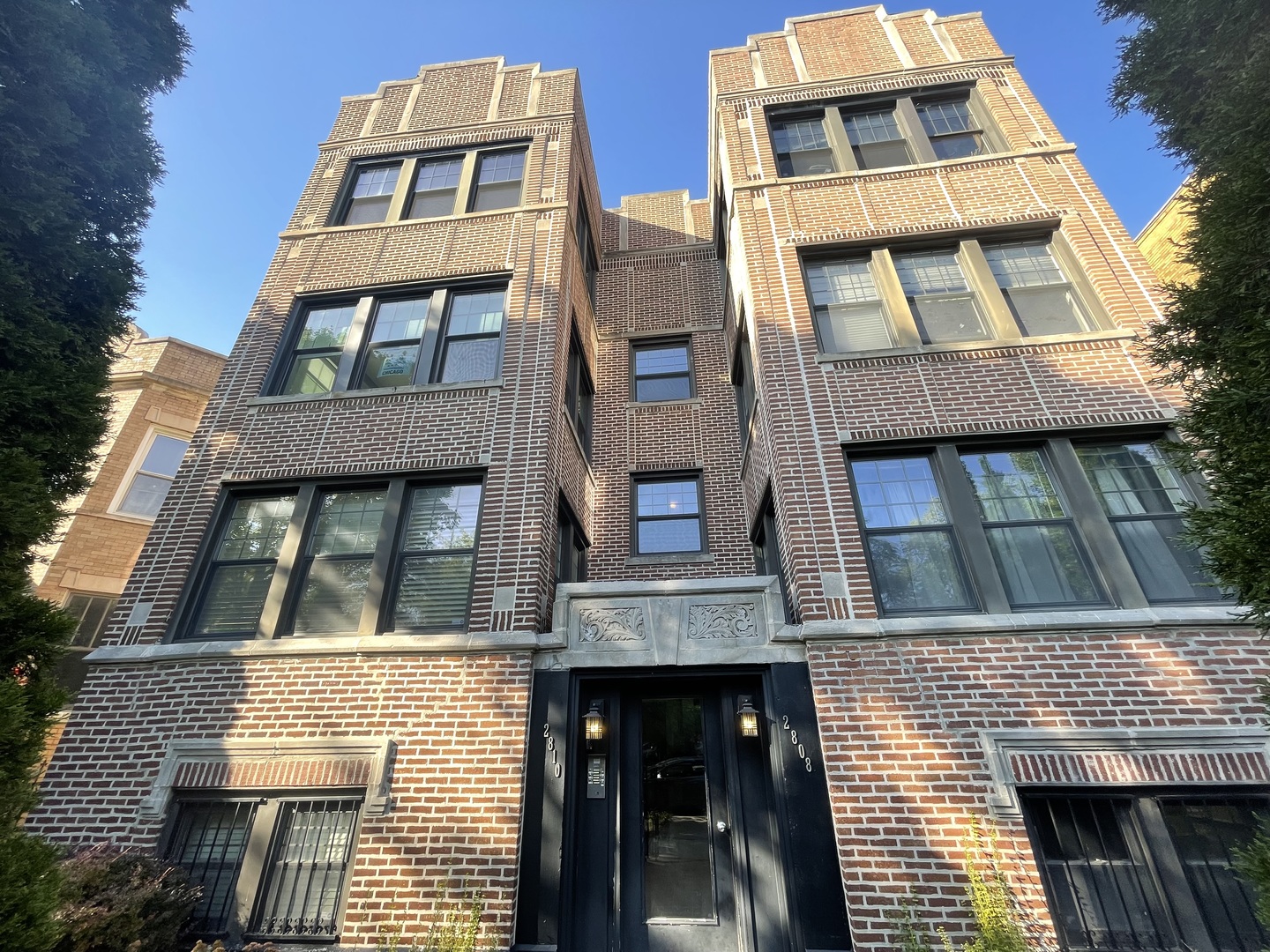 2810 West Logan Boulevard, Unit 3W Chicago, IL 60647 - Photo 2 of 34 a front view of residential houses