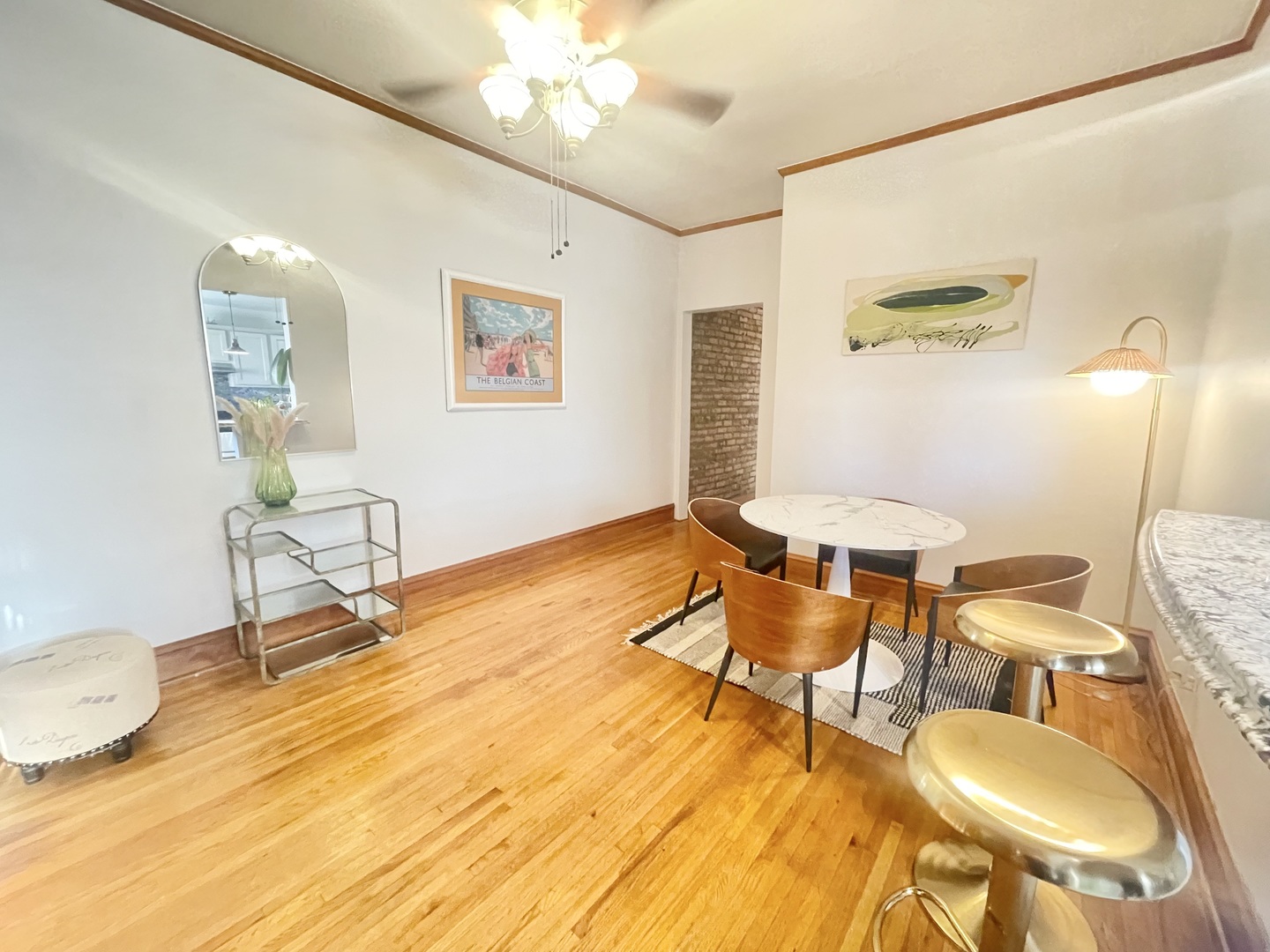 2810 West Logan Boulevard, Unit 3W Chicago, IL 60647 - Photo 23 of 34 a living room with dining room and wooden floor