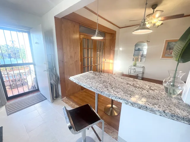 a terrace with outdoor seating and city view