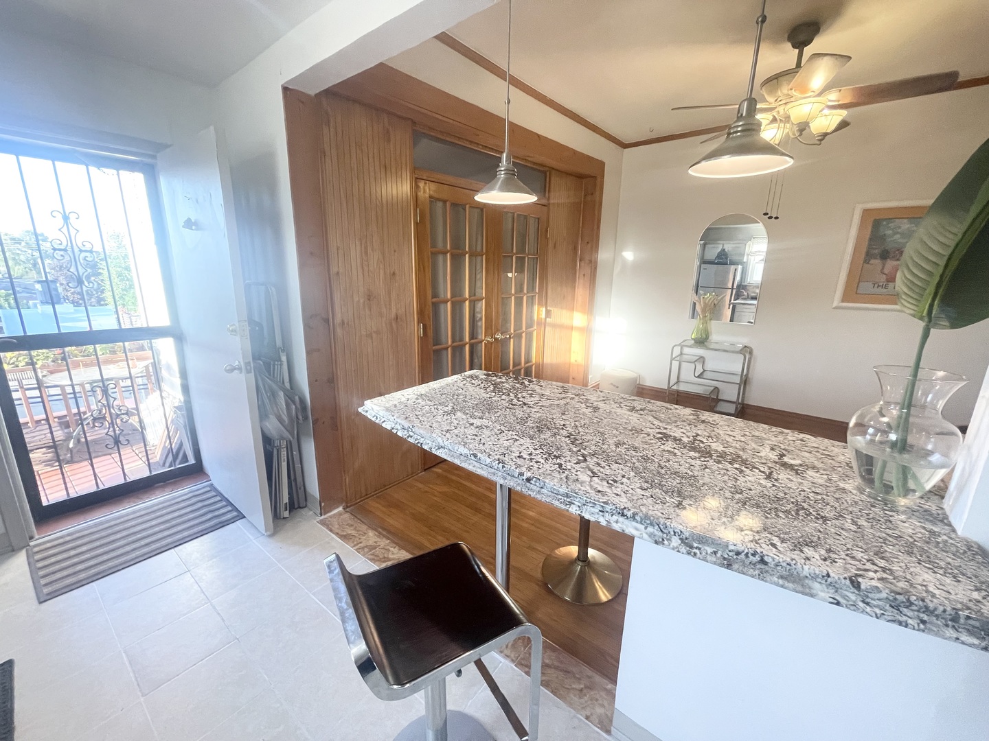 2810 West Logan Boulevard, Unit 3W Chicago, IL 60647 - Photo 31 of 34 a bathroom with a granite countertop sink and a mirror