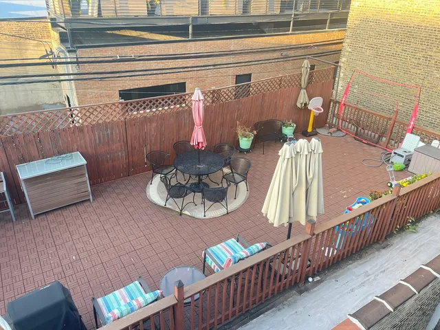 a living room with fireplace furniture and a large window