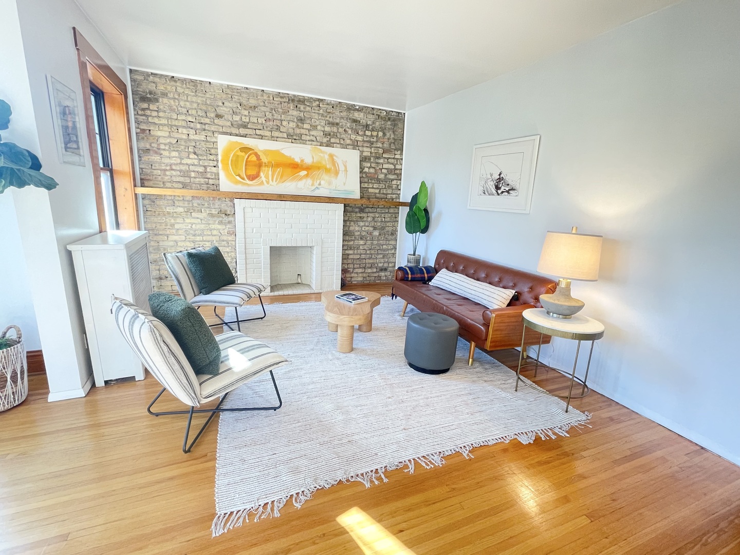 2810 West Logan Boulevard, Unit 3W Chicago, IL 60647 - Photo 9 of 34 a living room with furniture and wooden floor